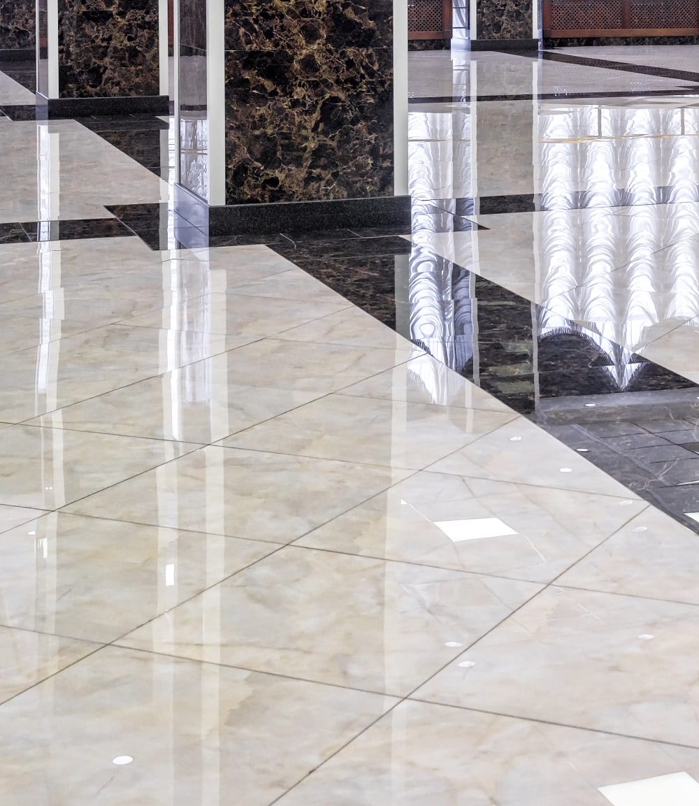 A marble floor with reflections of the ground.